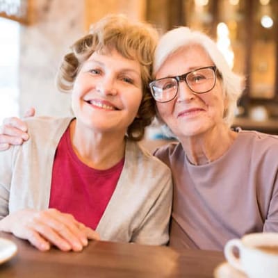 Two senior women smiling together