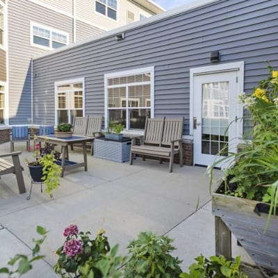 Outdoor patio area with seating and plants