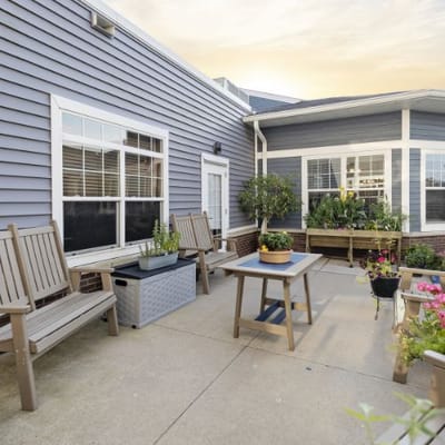 Outdoor seating area with plants and flowers
