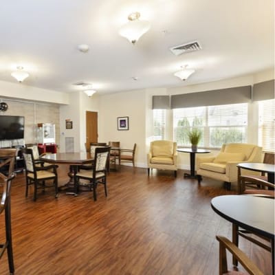 Bright common area with seating and tables