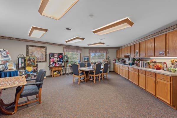 Bright activity room with tables and chairs