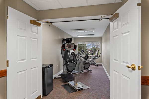 Interior view of a fitness room with exercise equipment