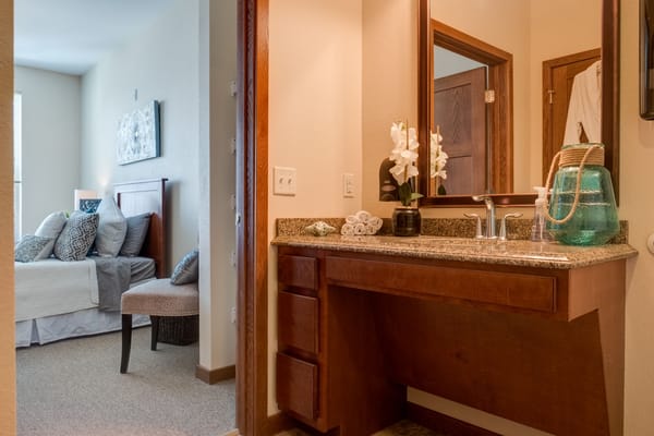 A well-designed private resident room with a bathroom