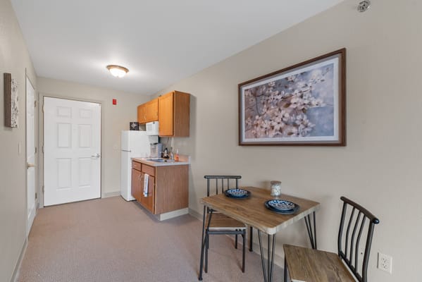 Cozy interior view of a private room with kitchen area
