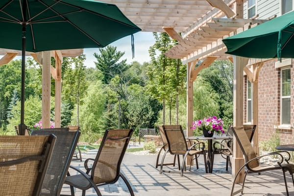 Patio area with seating and greenery