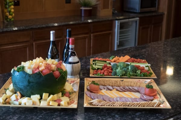 An elegant spread of fruit and snacks in a dining area
