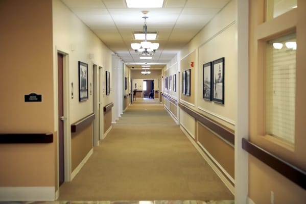 Interior hallway with pictures and lighting
