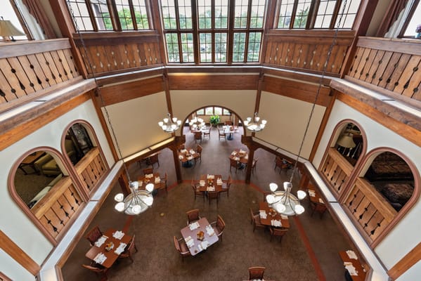 View of the dining room with tables and chandeliers