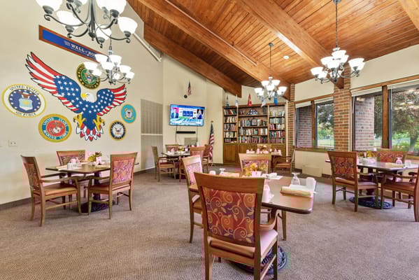 Dining room with military decorations and tables set for meals