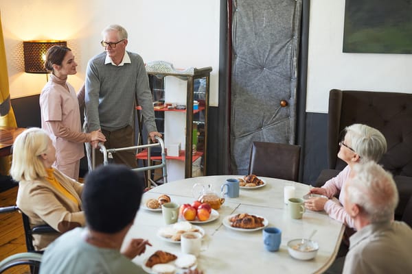Residents enjoying breakfast together in a dining area