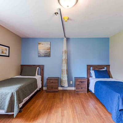 Private resident room with two beds and decor