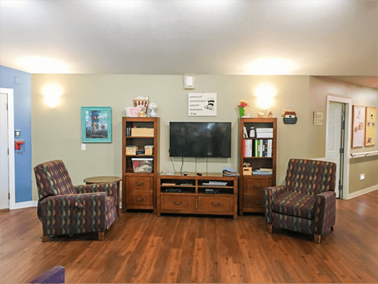 Cozy common area with seating and TV