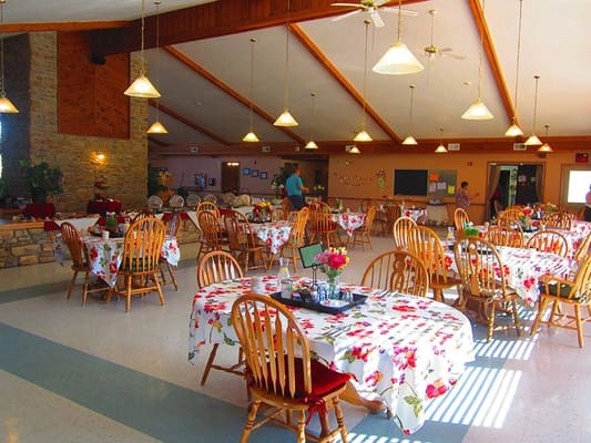 Interior dining room setup with floral tables