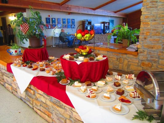 Table filled with dessert displays in a common area
