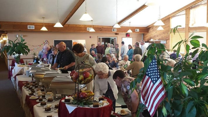 Residents enjoying a meal at a dining room event