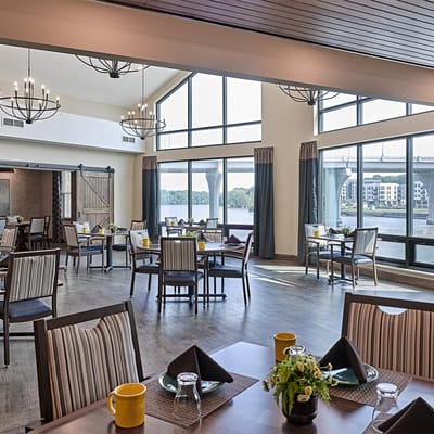 Bright dining room with large windows and elegant decor