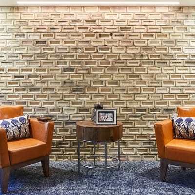 Cozy seating area with brick wall backdrop