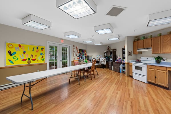 Bright activity room with tables and decorations