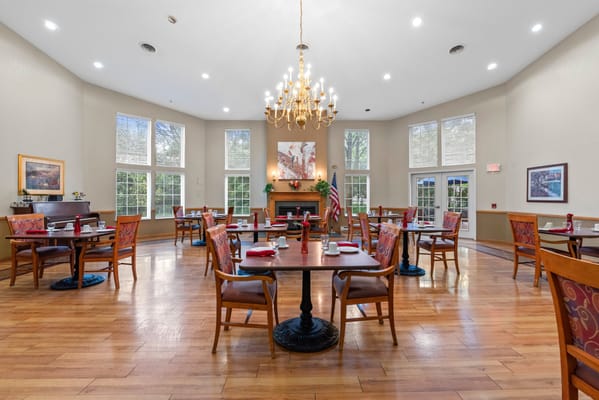 Dining room with tables set for residents