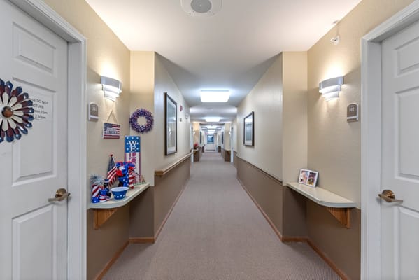 Brightly lit corridor with decorated walls