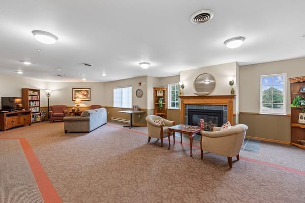 Common area with seating and a fireplace