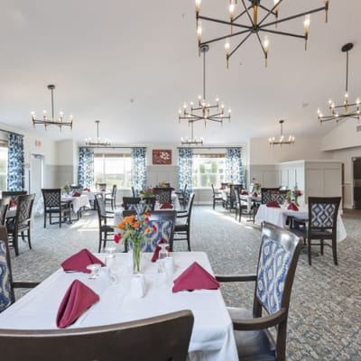 Elegant dining room setup with flowers and table settings