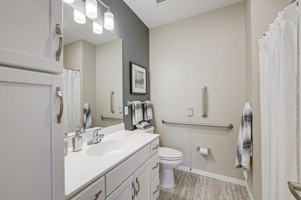 Clean and bright resident bathroom with modern fixtures