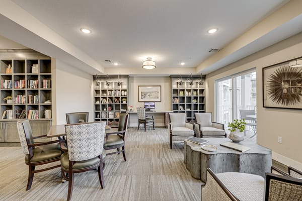 Bright common area with seating and bookshelves