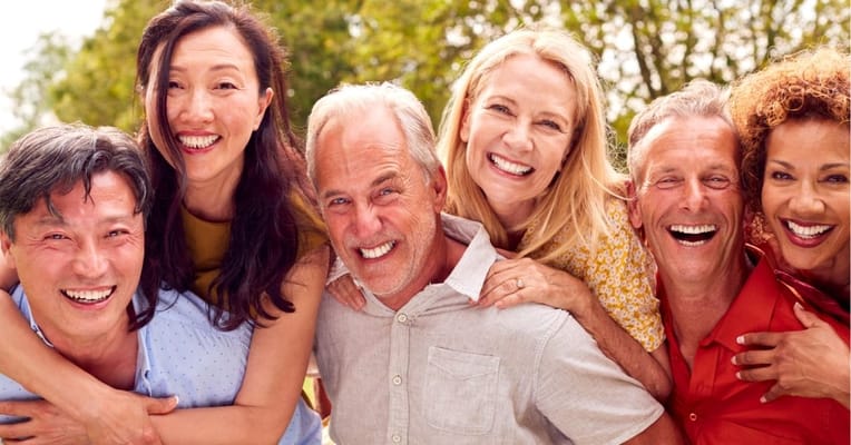 Group of seniors happily interacting outdoors