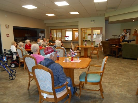 Residents enjoying a live music performance in a common area