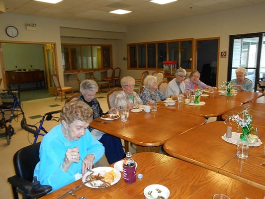 Residents enjoying a meal in the dining area