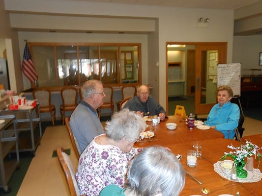 Residents enjoying lunch in a common area