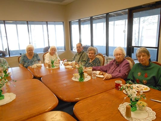 Residents enjoying a meal in a common area