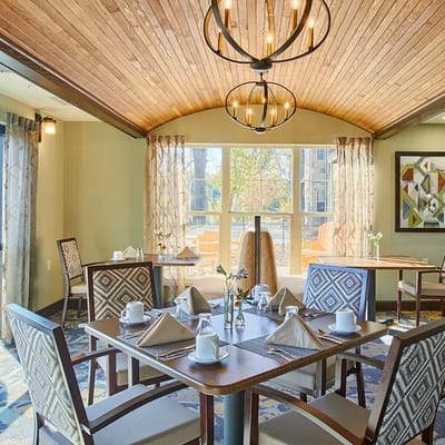 Bright dining area with tables set for meals