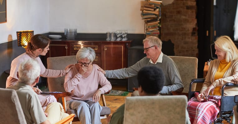 Residents participating in a group activity in a cozy common area