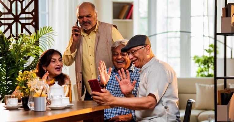 Residents enjoying a lively conversation in a common area