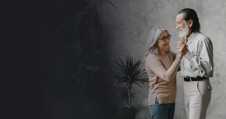 Couple dancing in a warm indoor setting