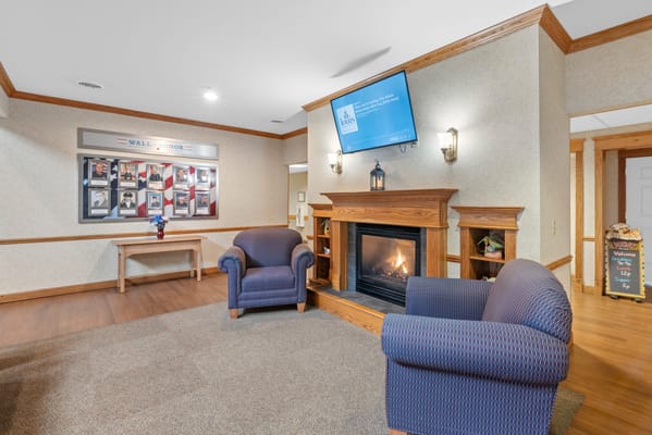 Interior of a common area with seating and fireplace