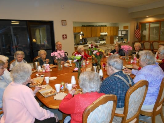 Residents enjoying lunch together in the dining room