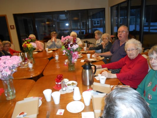 Residents enjoying a meal together in a dining area