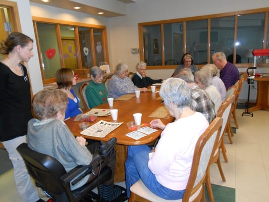 Residents playing bingo in a common area