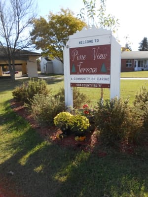 Signage for Pine View Terrace, welcoming visitors