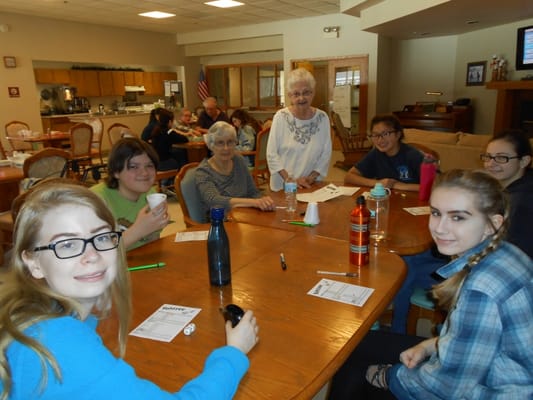 Residents and volunteers playing games in a common area