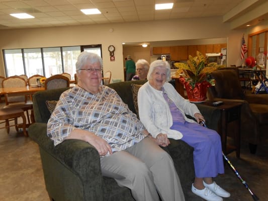 Two residents sitting together in a common area