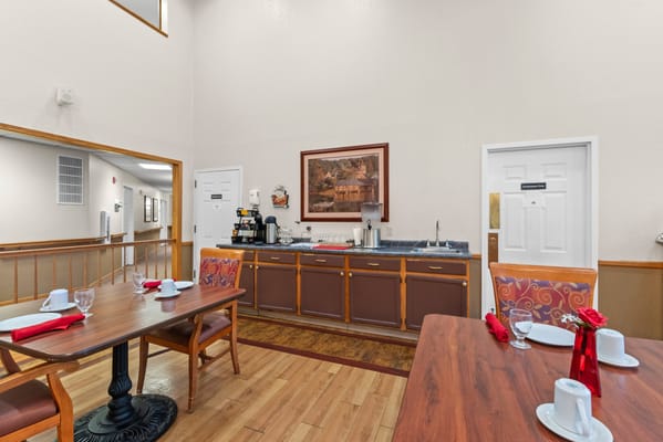 Dining area with set tables and coffee station