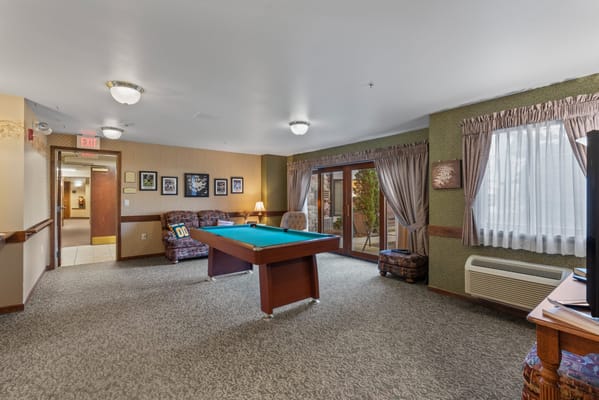 Common area with a pool table and seating