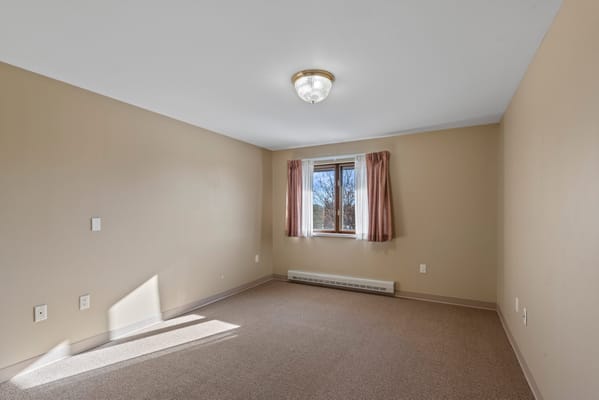Empty resident room with natural light from the window