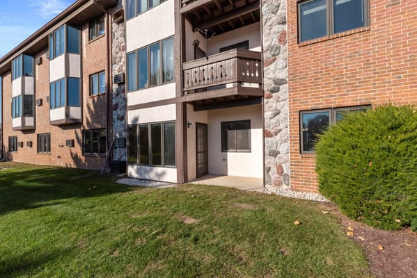 Exterior view of LakeHouse Sheboygan with grass and bushes