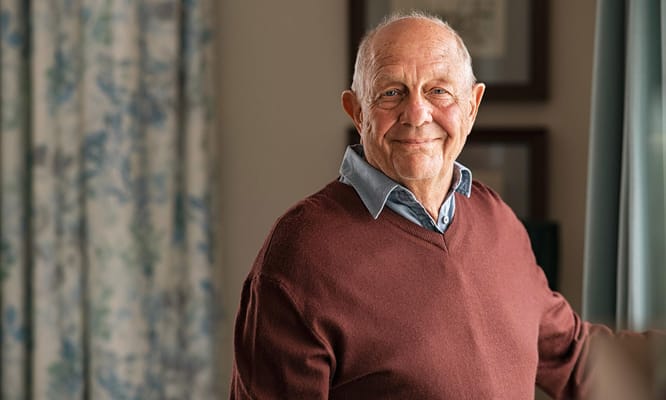 Smiling senior resident in a cozy interior