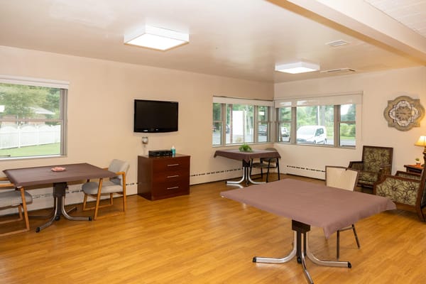 Bright interior common area with tables and chairs